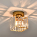 Crystal ceiling lampshade with polished finish, casting elegant light patterns, perfect for dining rooms and foyers.