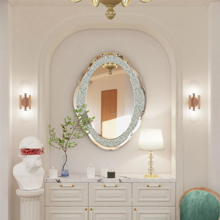 Elegant silver cloud-shaped mirror with crushed diamond finish on wall, enhancing luxurious home decor.