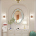 Elegant silver cloud-shaped mirror with crushed diamond finish on wall, enhancing luxurious home decor.