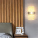 Modern LED acrylic wall lamp with Nordic design in a bedroom setting, enhancing decor and providing stylish illumination.