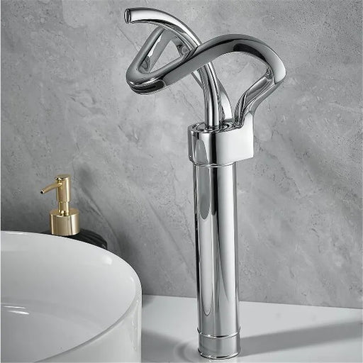 Sleek brass waterfall basin faucet with contemporary design and chrome finish in modern bathroom setting.