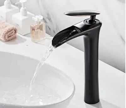 Elegant black waterfall basin mixer faucet in modern bathroom setting