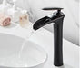 Elegant black waterfall basin mixer faucet in modern bathroom setting