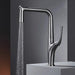 Innovative pull-out kitchen faucet with sleek brass design and powerful spray function for enhanced versatility