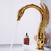 Luxury Swan Basin Mixer in gold, elegantly designed for a luxurious bathroom setup with smooth and precise water flow control.