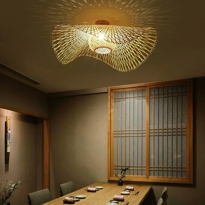 Japanese bamboo pendant lamp chandelier illuminating dining room with cozy lighting and elegant design.