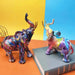 Artistic elephant statues with vibrant graffiti design, crafted from synthetic resin, displayed on a colorful background.