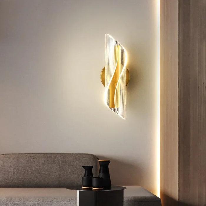 Modern Leo Lumis Wall Lamp with LED lights, mounted on a stylish wall, illuminating a cozy living room with a touch of elegance.