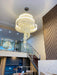 Modern Loft Spiral Chandelier with golden tassels in a contemporary interior setting.