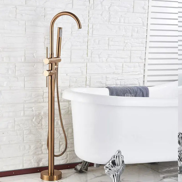 Modern swivel spout freestanding bath mixer in bronze next to white clawfoot bathtub in contemporary bathroom.