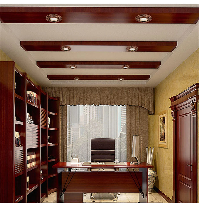 Modern office with wooden ceiling beams and recessed lighting, large glass window, and elegant wood furnishings.