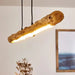 Rustic wooden LED pendant light with natural aesthetic and warm glow, perfect for modern kitchens or dining rooms.