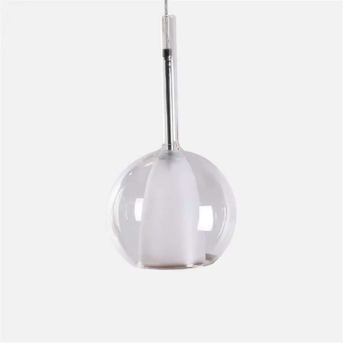 Modern clear glass pendant light with sleek design for contemporary home or restaurant decor.