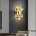 Modern luxury LED crystal wall lamp beautifully illuminating a contemporary living room.