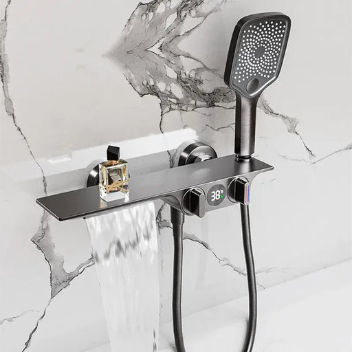 Smart LED Waterfall Shower System with digital display and polished brass finish on marble wall.