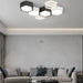 Modern hexagon-designed ultrathin LED ceiling light enhances a stylish living room with energy-efficient lighting.