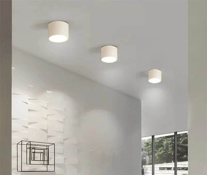 Modern wood grain LED ceiling downlights illuminating a sleek, contemporary room interior.