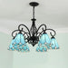 Mediterranean iron and stained glass LED chandelier with six blue shades, perfect for living rooms and bedrooms.