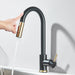 Touch sensor kitchen faucet with precision control, water flowing from modern black and gold design for hands-free convenience.