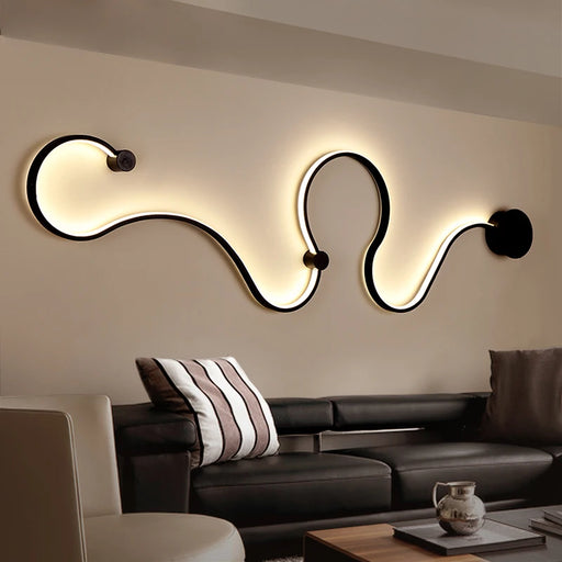 Modern Nordic curve wall lamp illuminating a stylish living room with elegant metal body and acrylic shade.