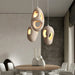 Modern Wabi-Sabi pendant light with Japanese style design hanging over a dining table in a contemporary room setting.