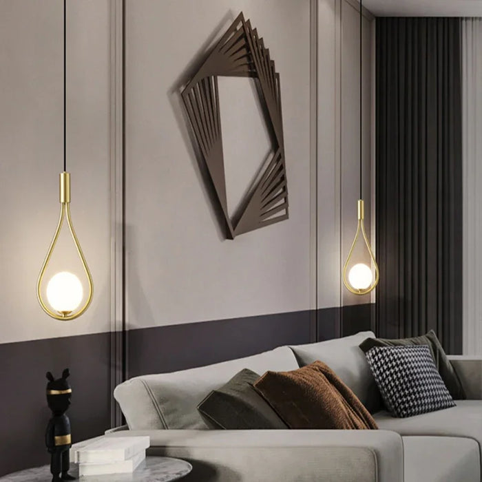 Modern frosted glass globe chandelier with LED bulbs in stylish living room setting.