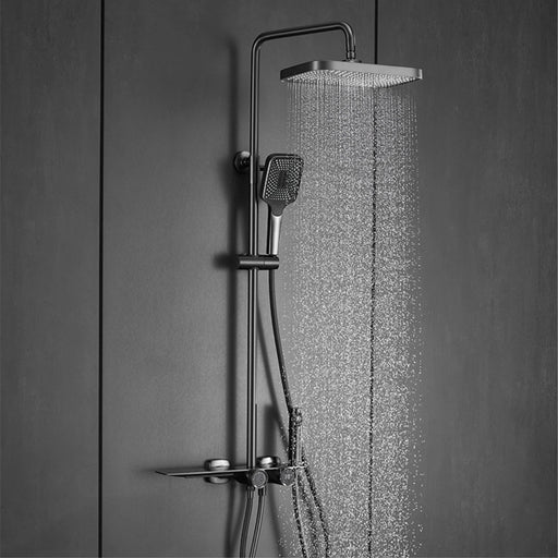 Luxury shower system with digital display and waterfall outlet in polished brass, featuring modern design and durable construction.