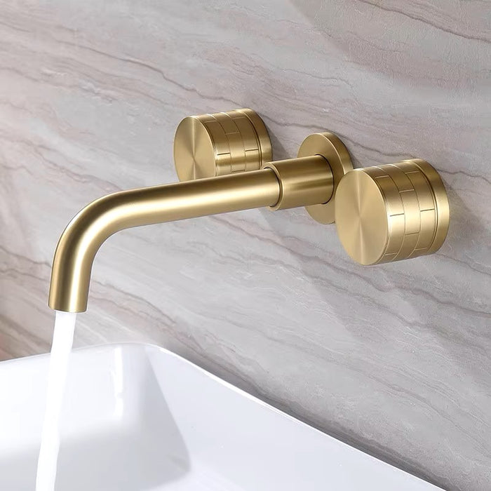 Brushed gold wall-mounted basin faucet with flowing water, modern design, and dual handles for precise temperature control.