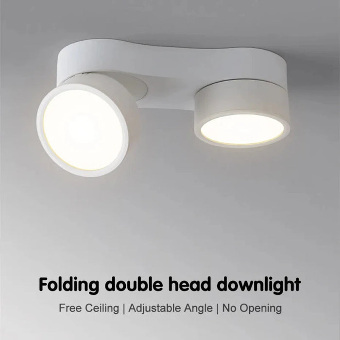 Foldable double head LED downlight with adjustable angle, modern ceiling lighting solution.