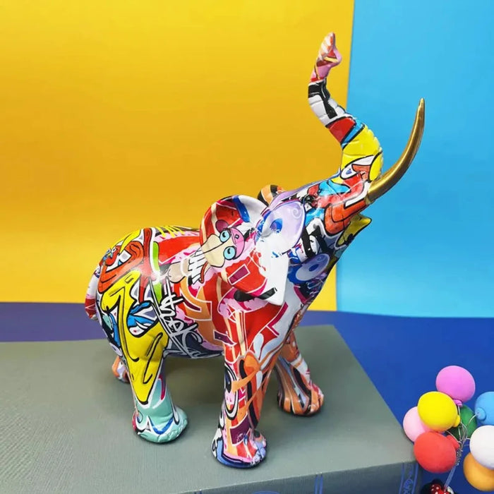 Colorful graffiti-designed elephant statue made of synthetic resin on a multicolored background.