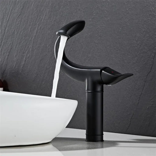 Flamingo Design Deck-Mount Basin Faucet with water flow, featuring a sleek black finish and modern, elegant silhouette for bathrooms.