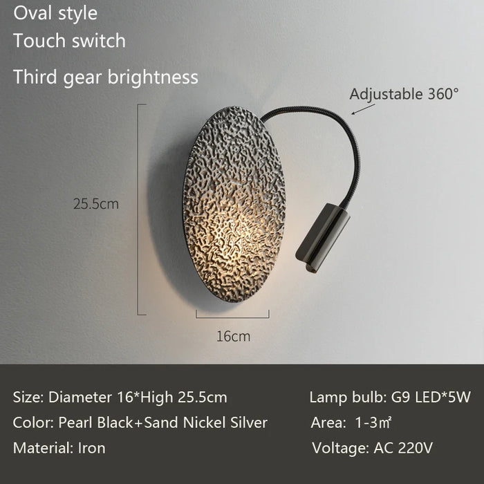 Italian luxury wall lamp with touch switch, oval design, adjustable 360°, sleek pearl black and sand nickel silver finish.