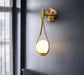 Gold Nordic Elegance Drop Wall Lamp with frosted glass, LED bulb, wall mounted, up & down light direction, modern home decor.