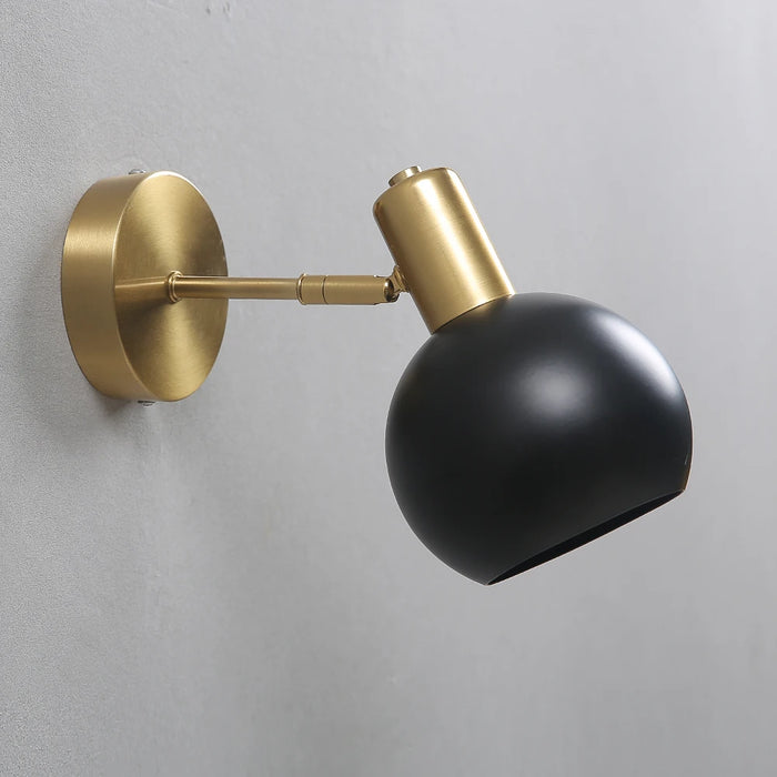 Modern adjustable long arm LED wall lamp in black and gold, enhancing home lighting with sleek and functional design.