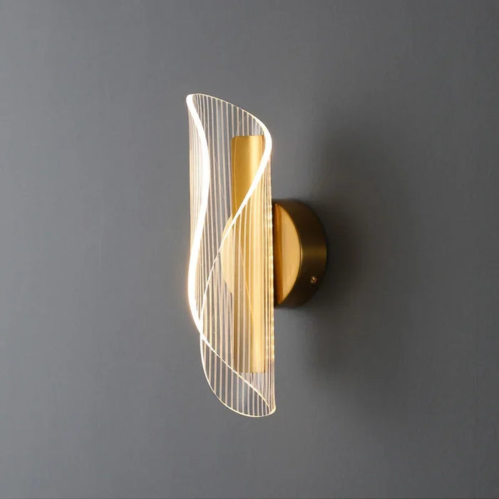 Modern Leo Lumis LED Wall Lamp with gold finish and acrylic shade, perfect for elevating room ambiance.