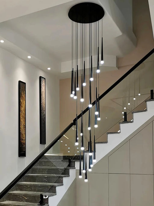 Modern chandelier with black cord pendant design illuminating a stylish stairway, ideal for spaces 15-30 square meters.