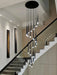 Modern chandelier with black cord pendant design illuminating a stylish stairway, ideal for spaces 15-30 square meters.