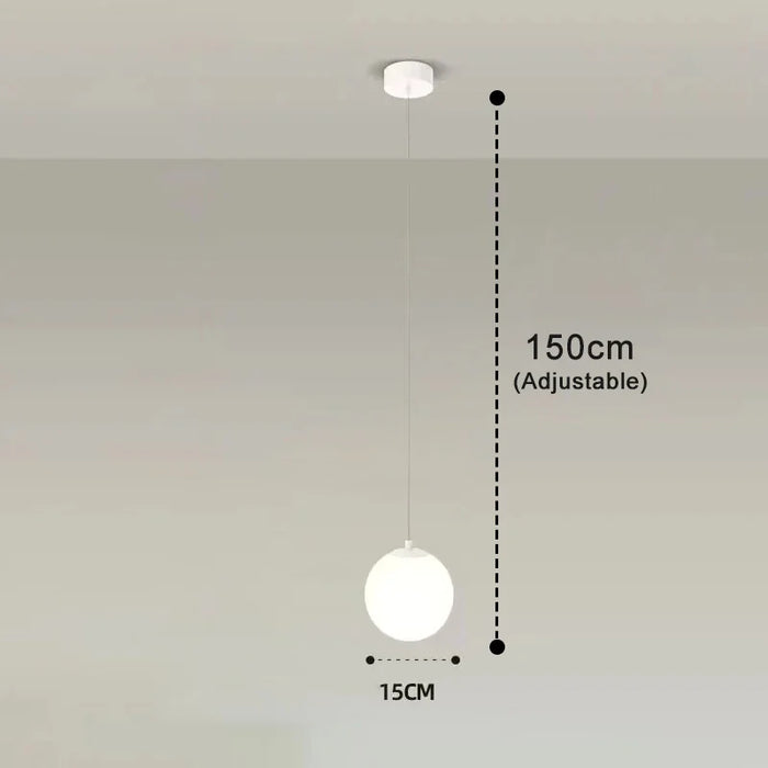 Modern round glass pendant light with adjustable height, alloy and glass finish, suitable for various room settings.