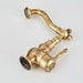 Vintage brass single handle basin faucet with ornate design, made from high-quality antique brass for classic bathroom elegance.