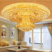 Luxury gold crystal chandelier illuminating a stylish living room interior.