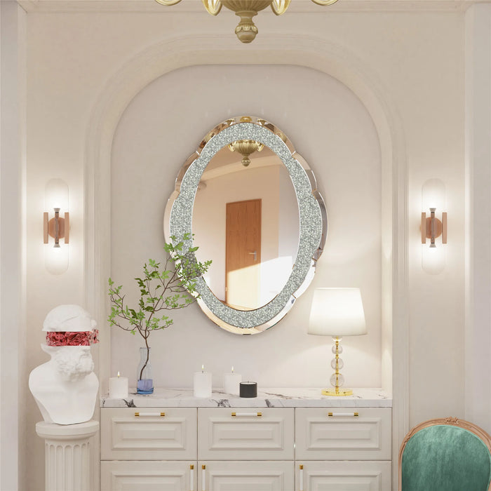 Elegant silver cloud-shaped wall mirror with crushed diamond finish in a stylish room setting.