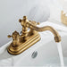 Classic bronze dual-handle basin mixer with 360° swivel spout, crafted from durable brass, adds charm and flexibility to bathroom sink.