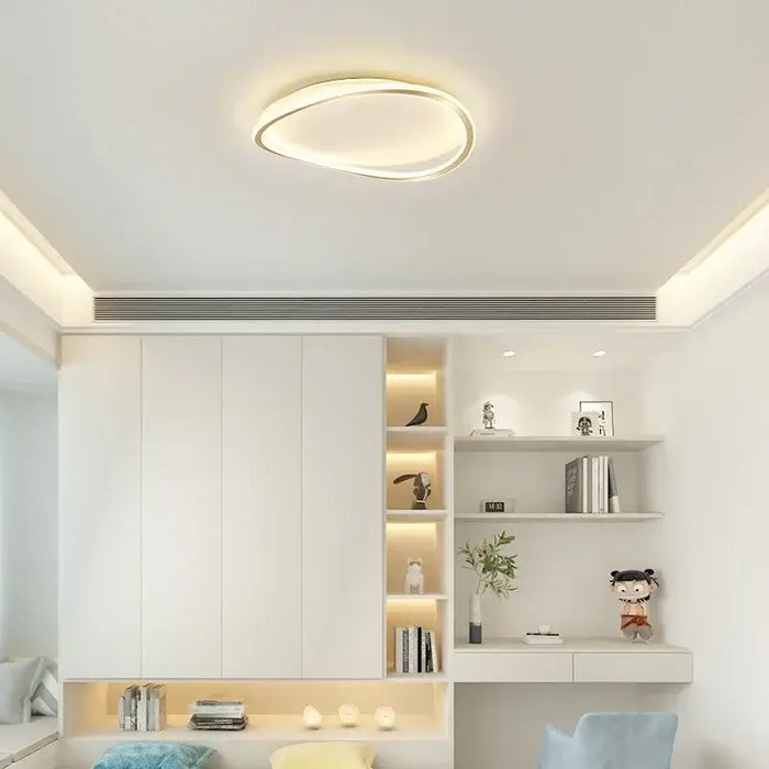 Modern LED ceiling flush mount lamp illuminating a contemporary living room with sleek design and minimalist aesthetic.