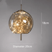 Starburst Glass Dome Pendant Light with gold accents, 20cm diameter, warm glow, elegant design for cozy ambiance.