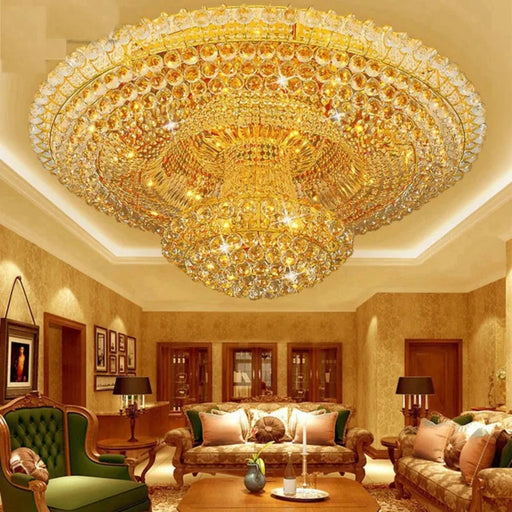 Luxurious crystal chandelier with golden circular design in an elegant living room setting.