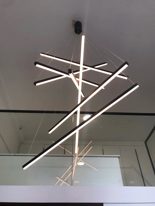 Modern smart chandelier with geometric design and dimmable LED lights for versatile home lighting control.