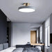 Modern Macaron LED Ceiling Light illuminating a stylish living room with contemporary decor.