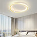 Modern LED ceiling flush mount lamp illuminating a bedroom with sleek, contemporary design and elegant lighting.