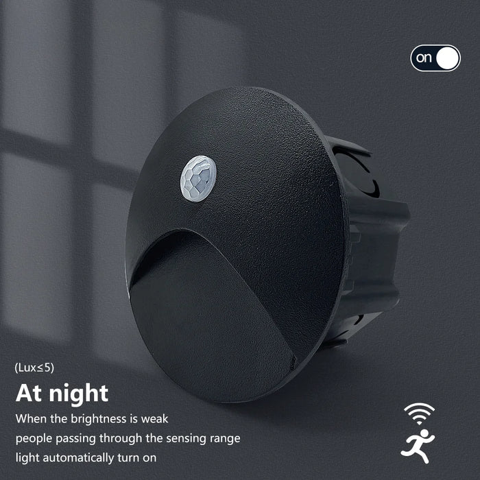 Recessed LED motion sensor wall lamp with smart light control and durable construction, shown in nighttime operation mode.