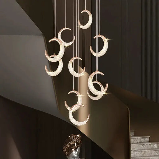 Elegant adjustable crescent moon chandelier with sleek design, perfect for modern spaces and varied ceiling heights.